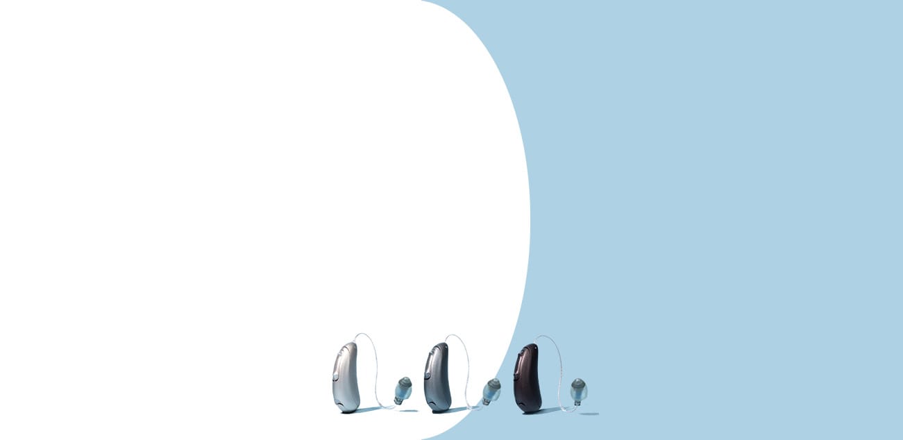 three hearing aids on blue background