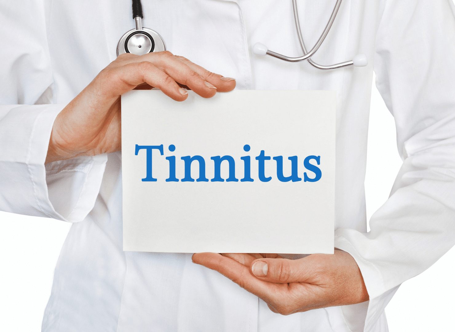 Medical professional holds sign that reads "tinnitus"